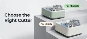 Two professional cutting machines placed side by side on a clean workbench: metal cutting machine with cooling system on the left, and gemstone cutting machine with adjustable vise and diamond blade on the right, both isolated on a tidy white background for industrial comparison.